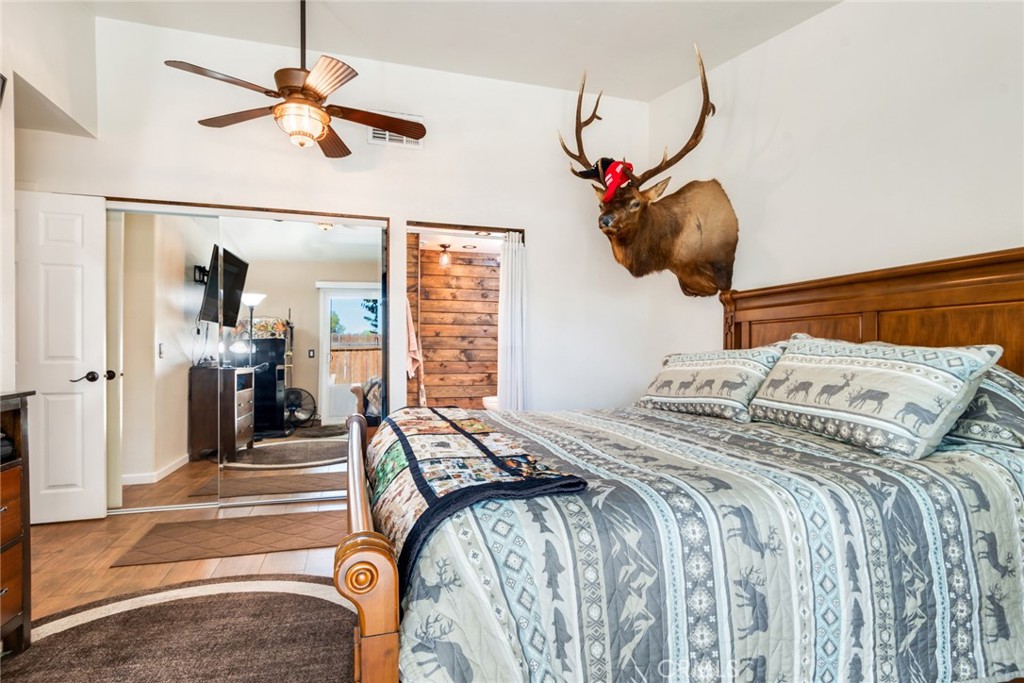 3198 Bexfield Court Riverside, CA 92503 - Photo 17 of 22 a bedroom with a bed and a chandelier