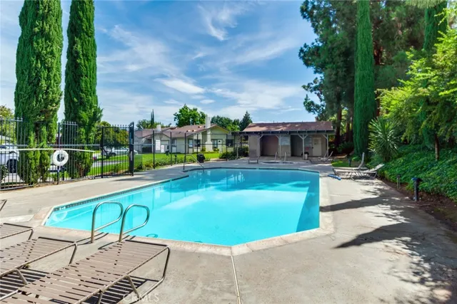 a view of a swimming pool with a patio