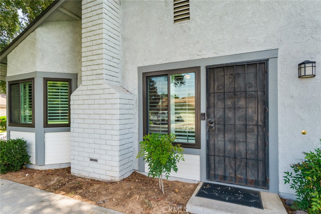 3198 Bexfield Court Riverside, CA 92503 - Photo 4 of 22 a front view of a house with a yard