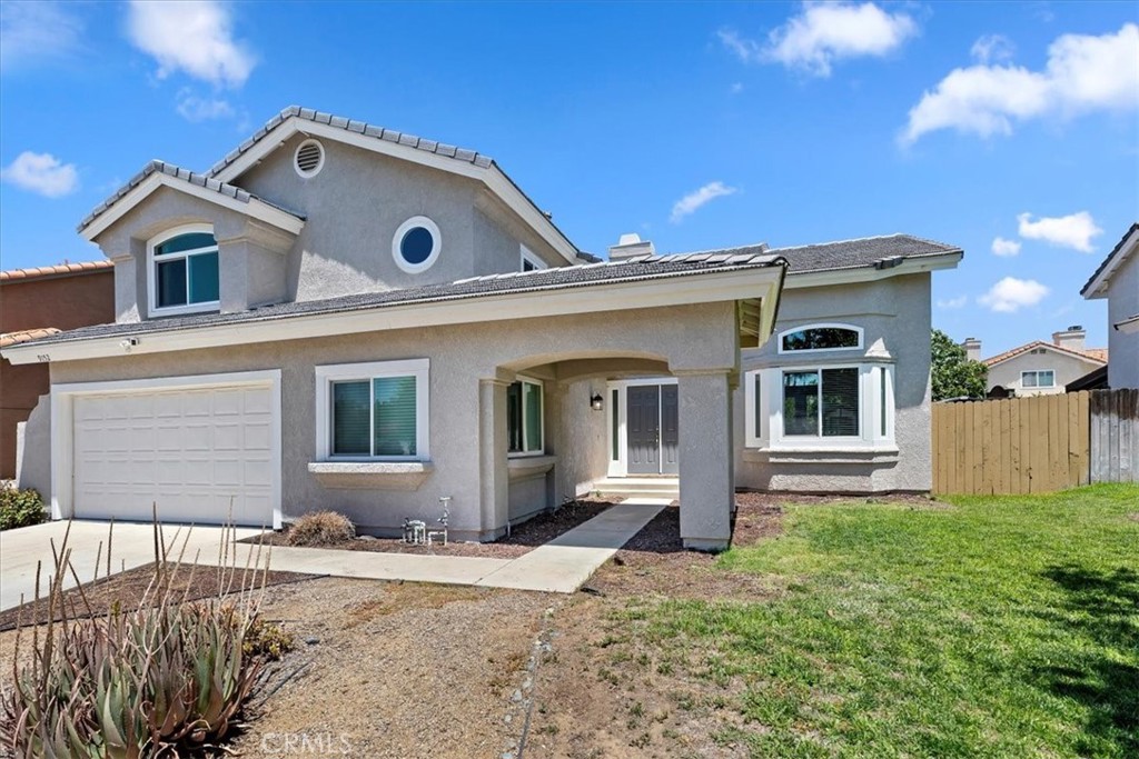 9152 Owari Lane Riverside, CA 92508 - Photo 1 of 20 a front view of a house with a yard