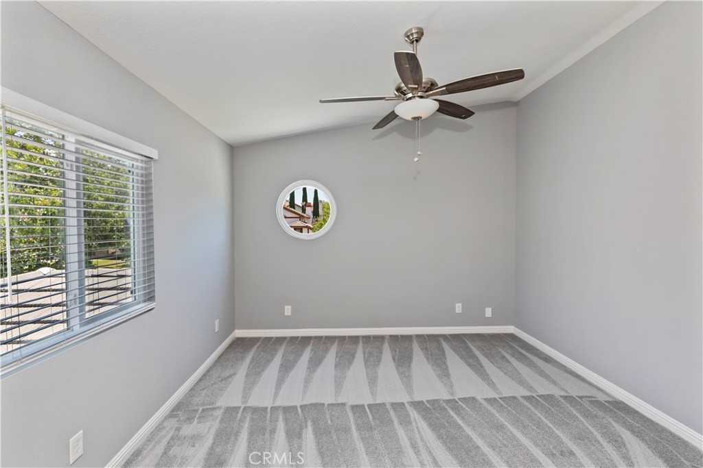 9152 Owari Lane Riverside, CA 92508 - Photo 14 of 20 a view of a room with a window and a ceiling fan