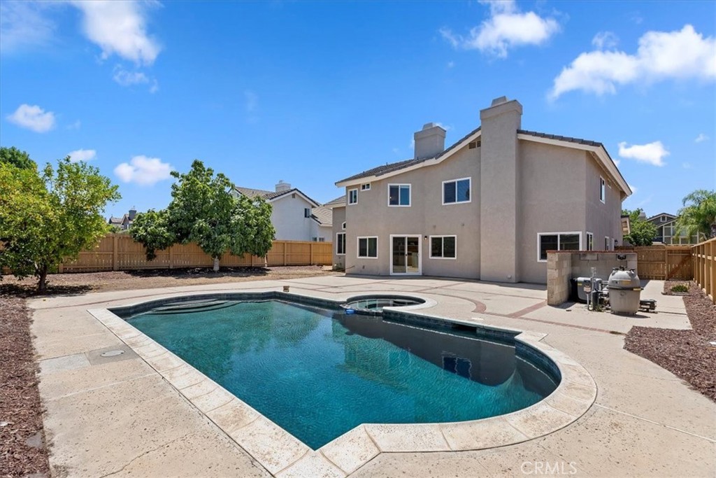 9152 Owari Lane Riverside, CA 92508 - Photo 16 of 20 a swimming pool with outdoor seating and yard