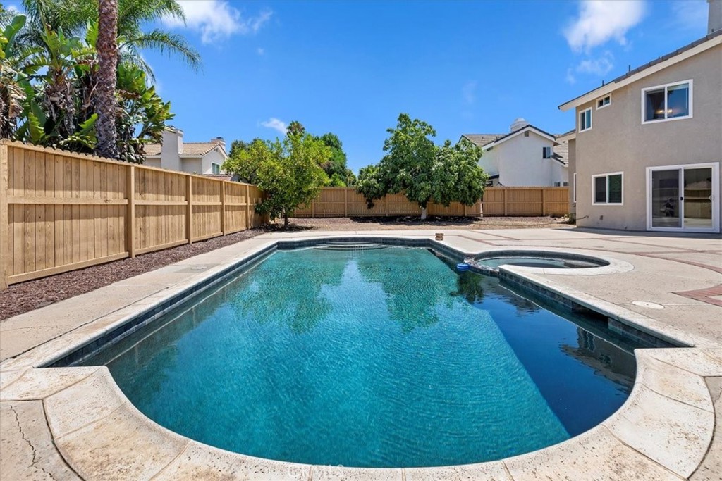 9152 Owari Lane Riverside, CA 92508 - Photo 19 of 20 a view of a swimming pool with a outdoor seating