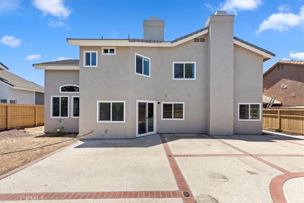 9152 Owari Lane Riverside, CA 92508 - Photo 20 of 20 a front view of a house with a yard