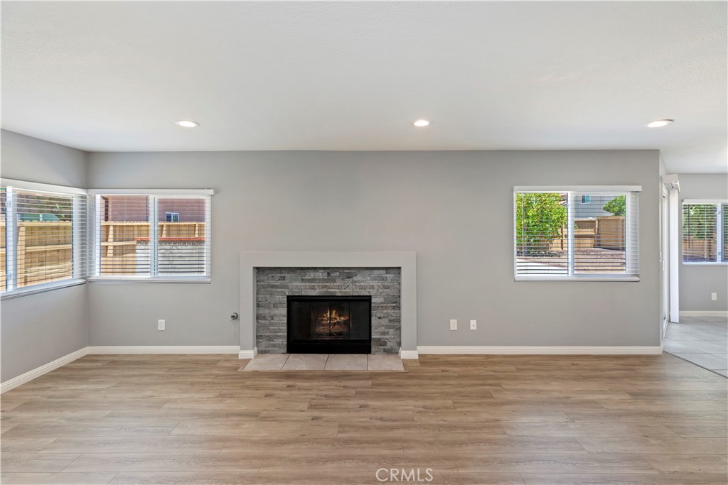9152 Owari Lane Riverside, CA 92508 - Photo 4 of 20 a view of an empty room with window and fire place