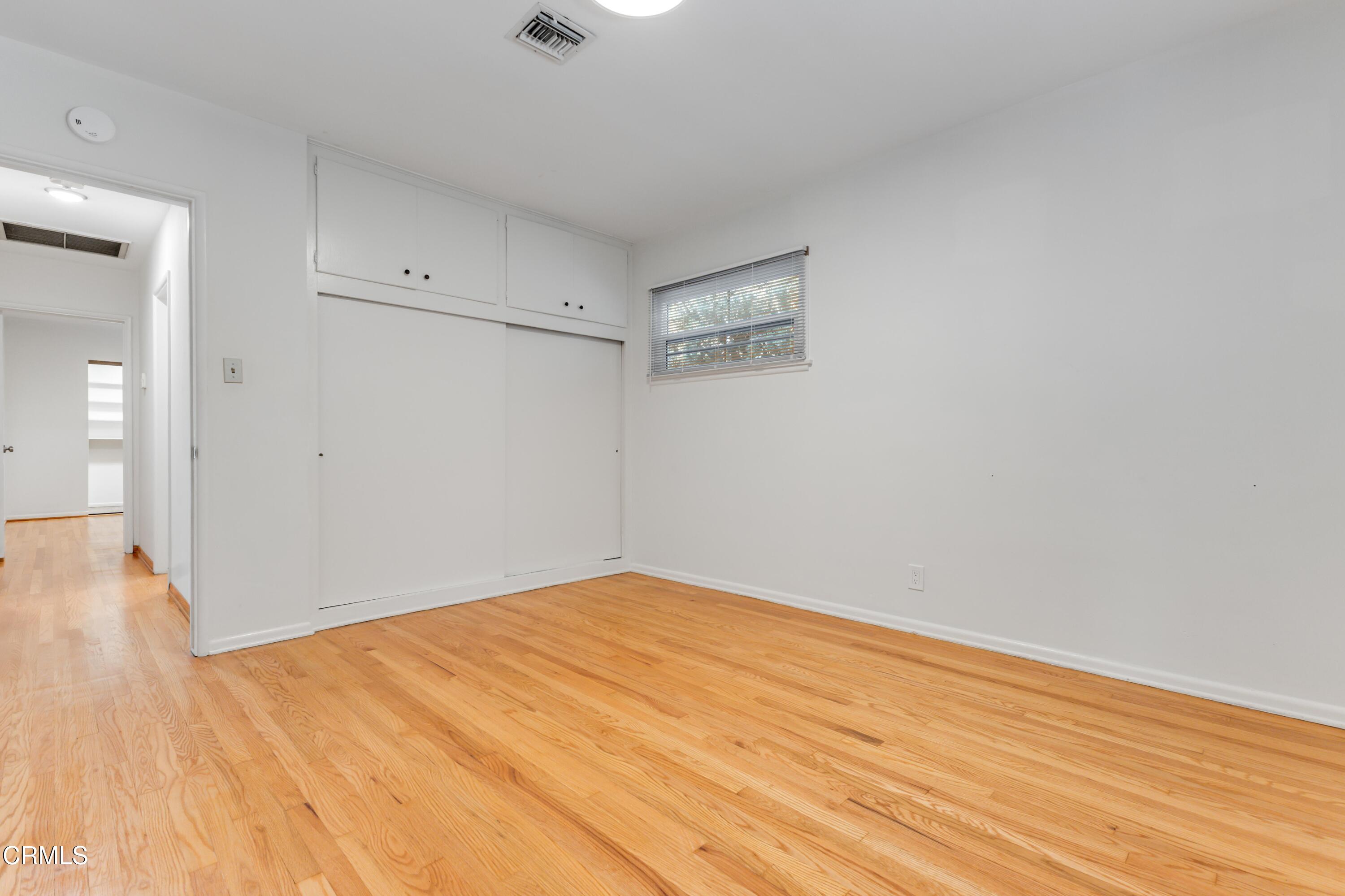 5622 Bellingham Avenue Valley Village, CA 91607 - Photo 14 of 24 a view of empty room with wooden floor