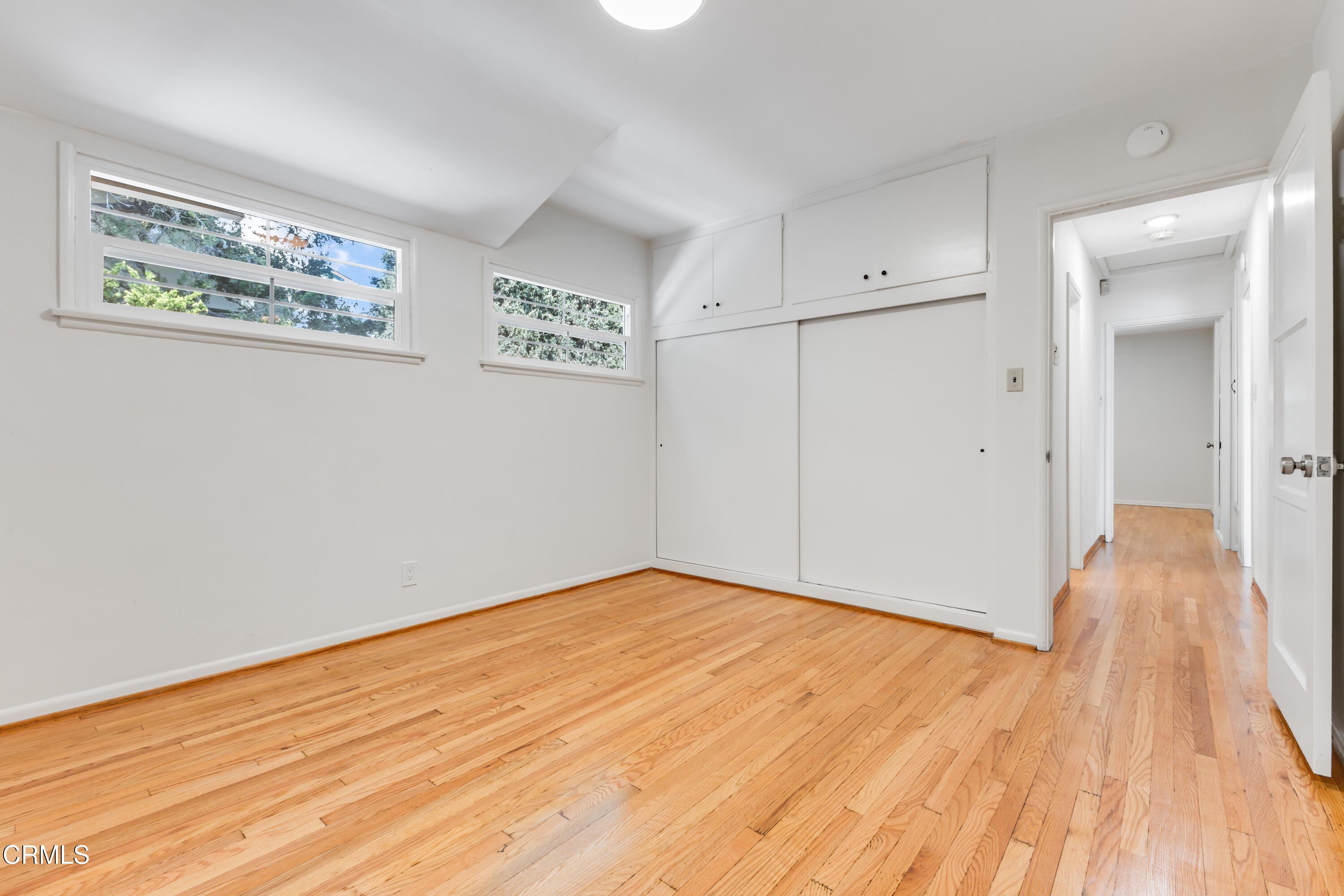 5622 Bellingham Avenue Valley Village, CA 91607 - Photo 18 of 24 a view of an empty room with wooden floor