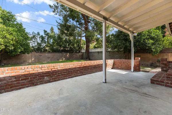 a view of backyard with seating space