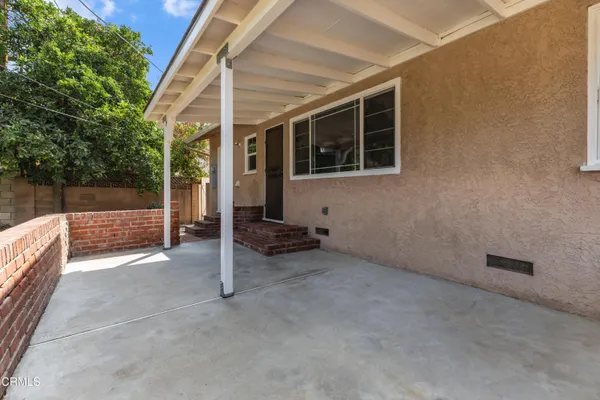 a swimming pool with green space