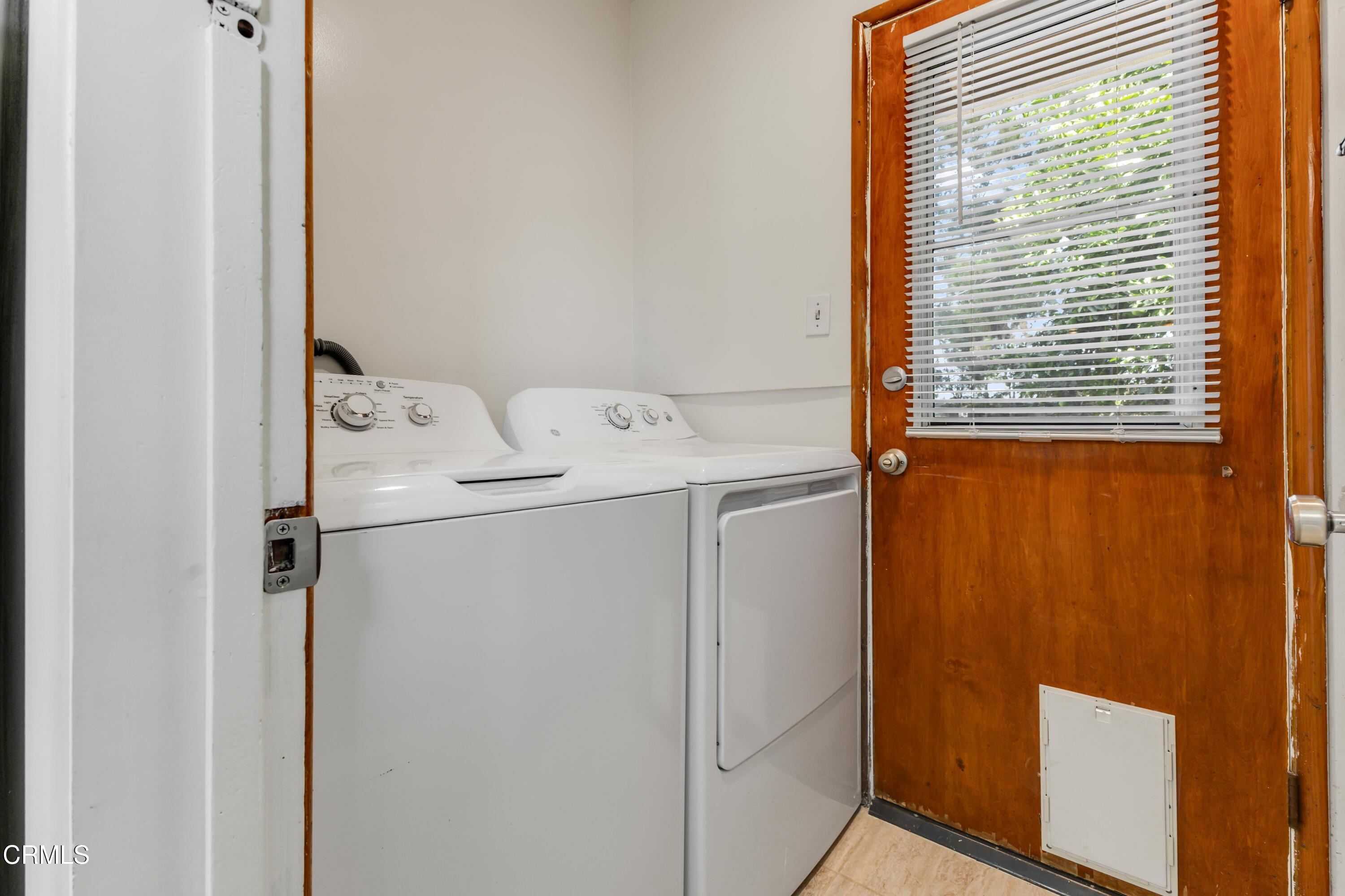 5622 Bellingham Avenue Valley Village, CA 91607 - Photo 9 of 24 a utility room with dryer and washer