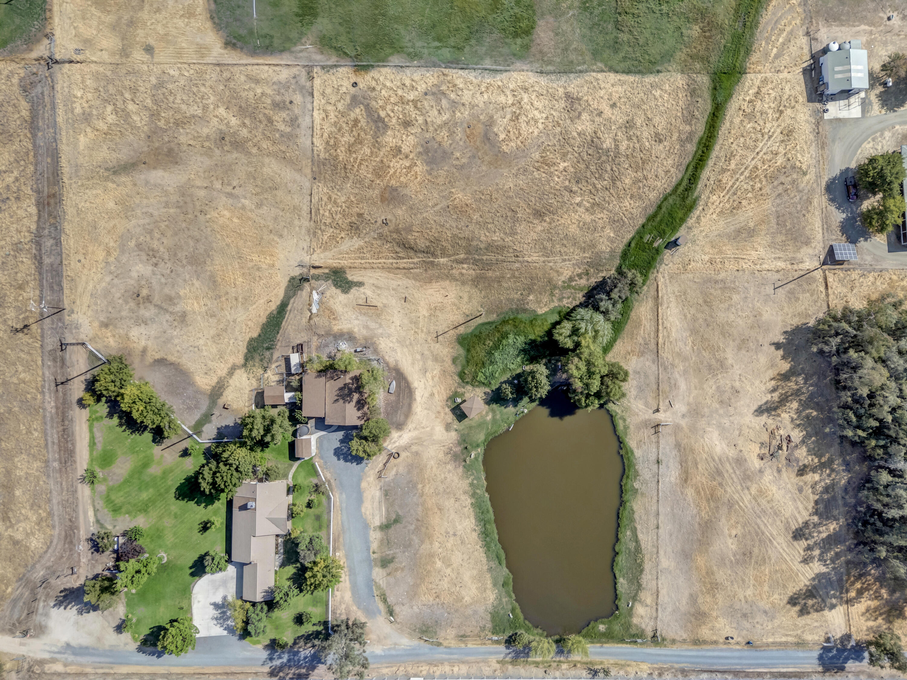 18002 320th Road Springville, CA 93265 - Photo 53 of 56 an aerial view of a house with a yard and plants