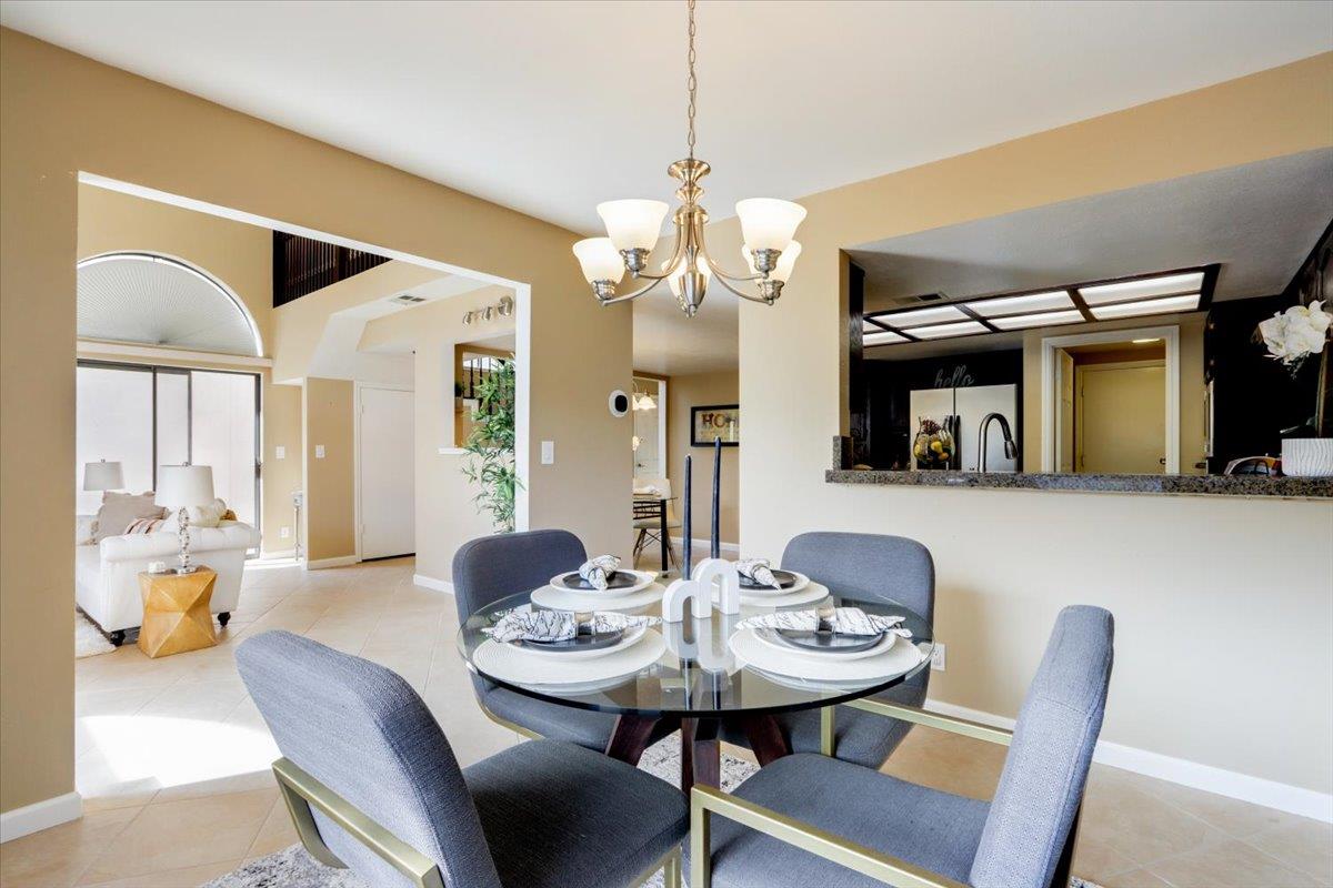 945 Oak Park Drive Morgan Hill, CA 95037 - Photo 13 of 46 a view of a dining room with furniture and a chandelier