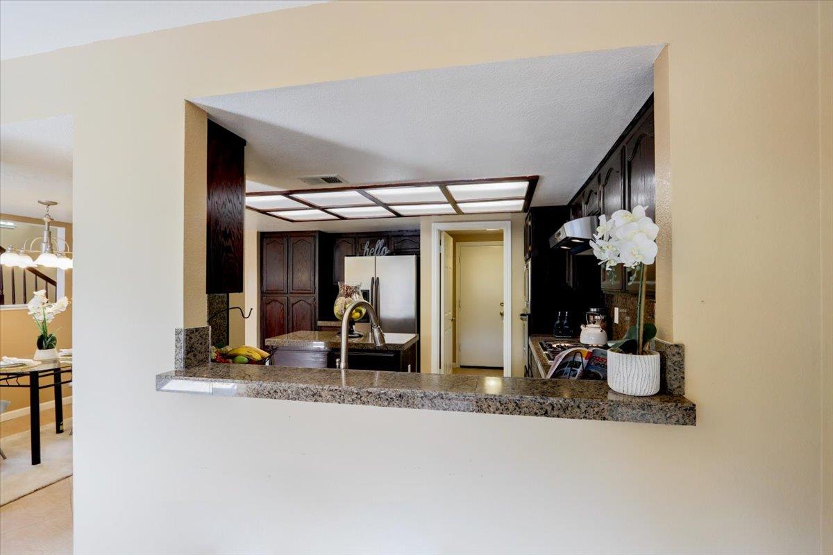 945 Oak Park Drive Morgan Hill, CA 95037 - Photo 14 of 46 a view of a living room with gym equipment