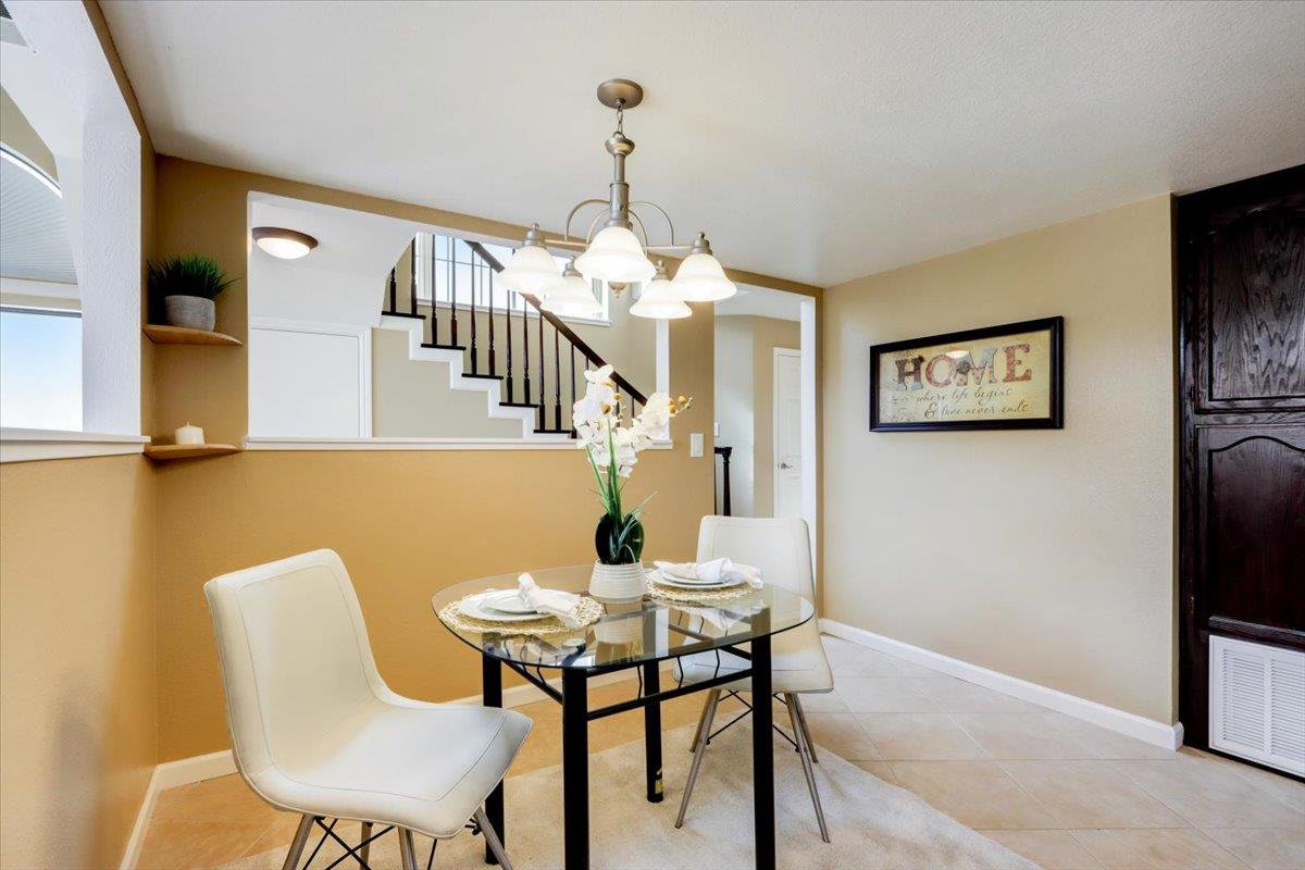 945 Oak Park Drive Morgan Hill, CA 95037 - Photo 20 of 46 a view of a dining room with furniture and a chandelier