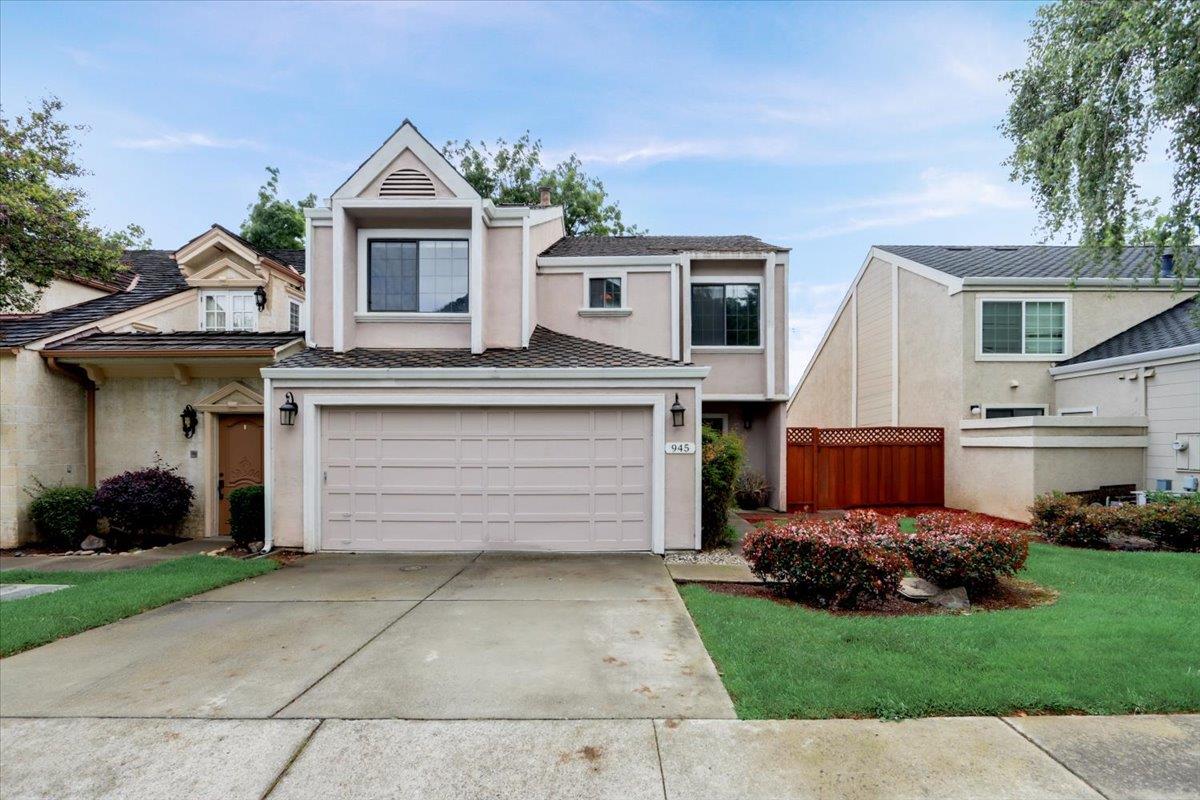 945 Oak Park Drive Morgan Hill, CA 95037 - Photo 2 of 46 a front view of a house with a garden