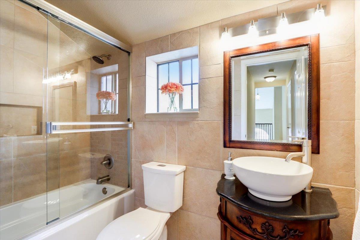 945 Oak Park Drive Morgan Hill, CA 95037 - Photo 22 of 46 a bathroom with a sink a toilet and a bathtub