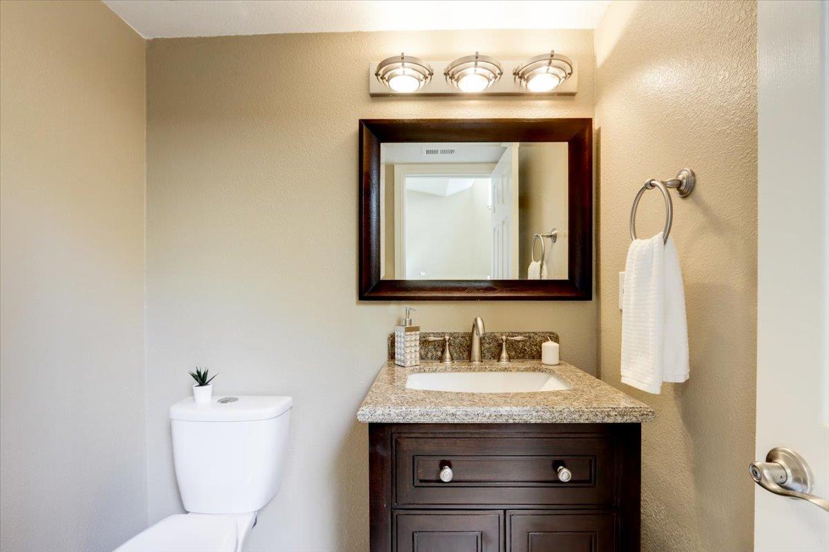 945 Oak Park Drive Morgan Hill, CA 95037 - Photo 23 of 46 a bathroom with a toilet sink and mirror