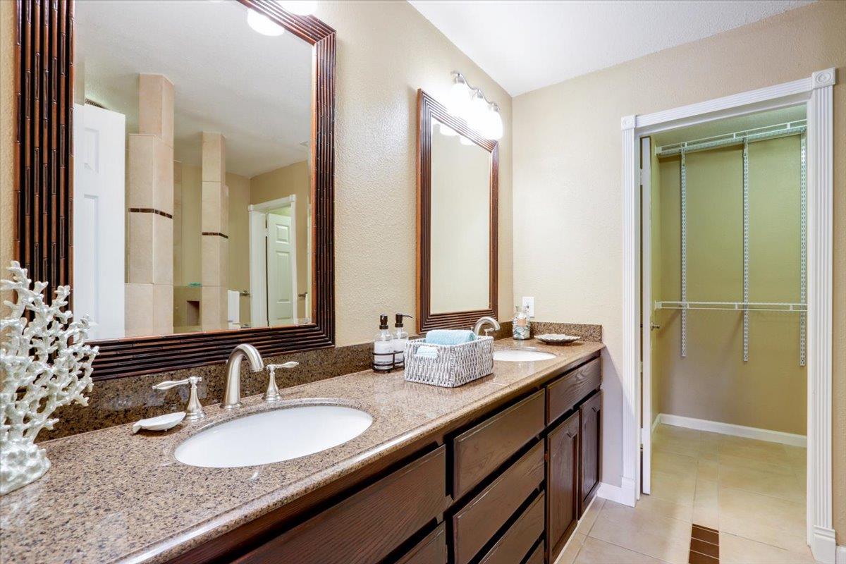 945 Oak Park Drive Morgan Hill, CA 95037 - Photo 27 of 46 a bathroom with double vanity sinks and a mirror