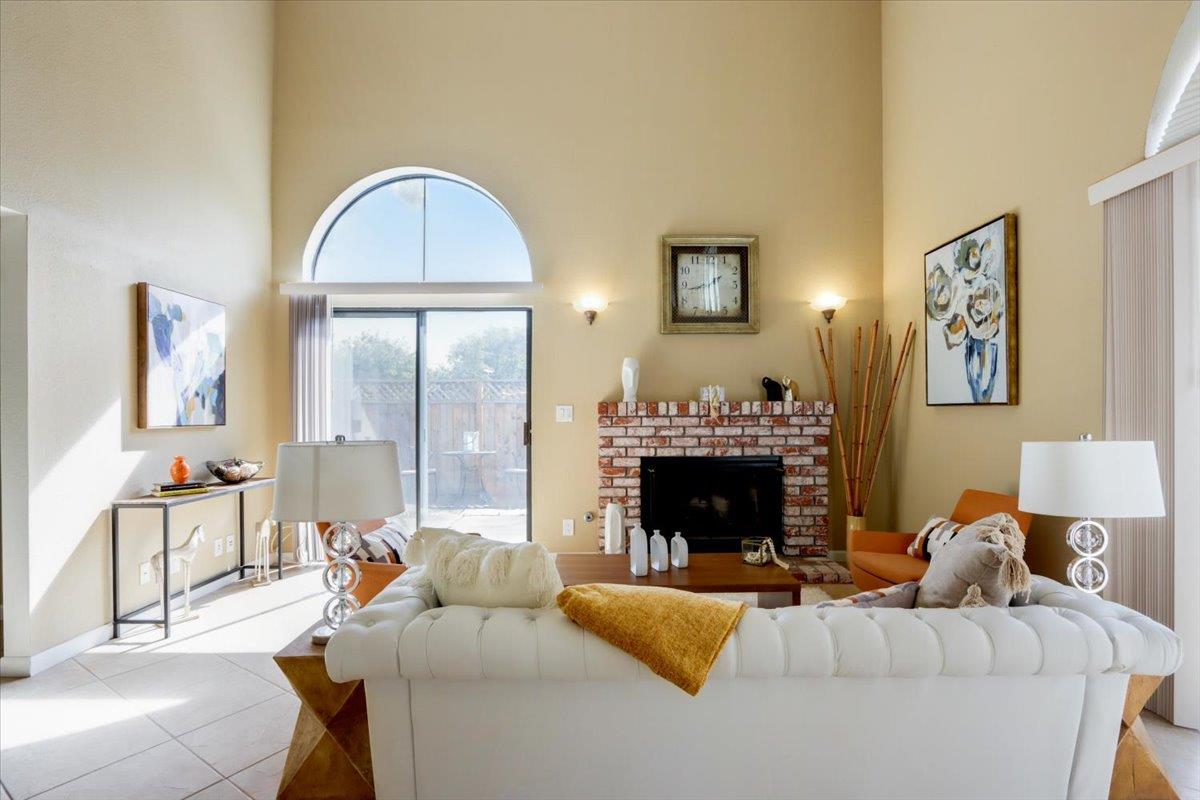 945 Oak Park Drive Morgan Hill, CA 95037 - Photo 5 of 46 a living room with furniture and a fireplace