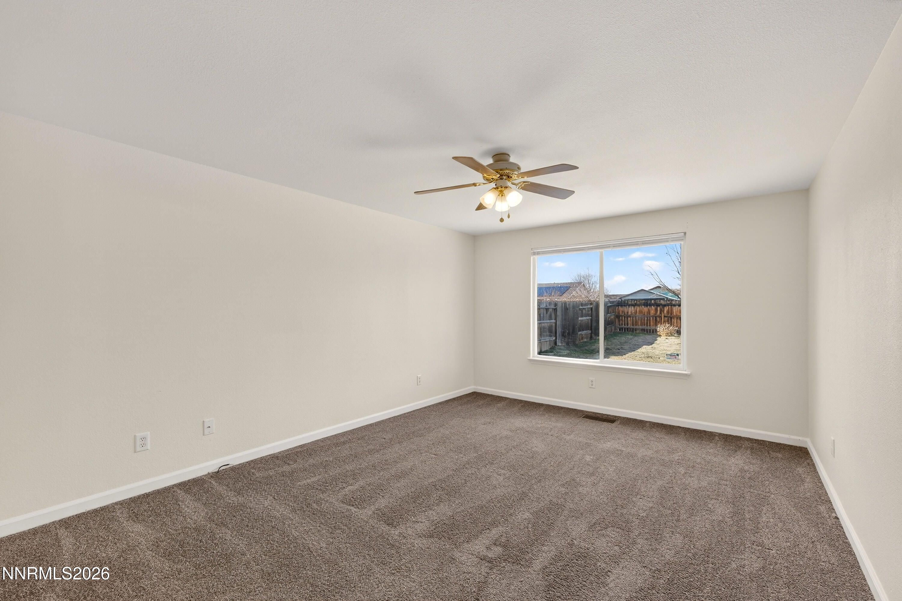 1222 Eagle Rock Road Fallon, NV 89406 - Photo 13 of 27 a view of an empty room with a chandelier fan