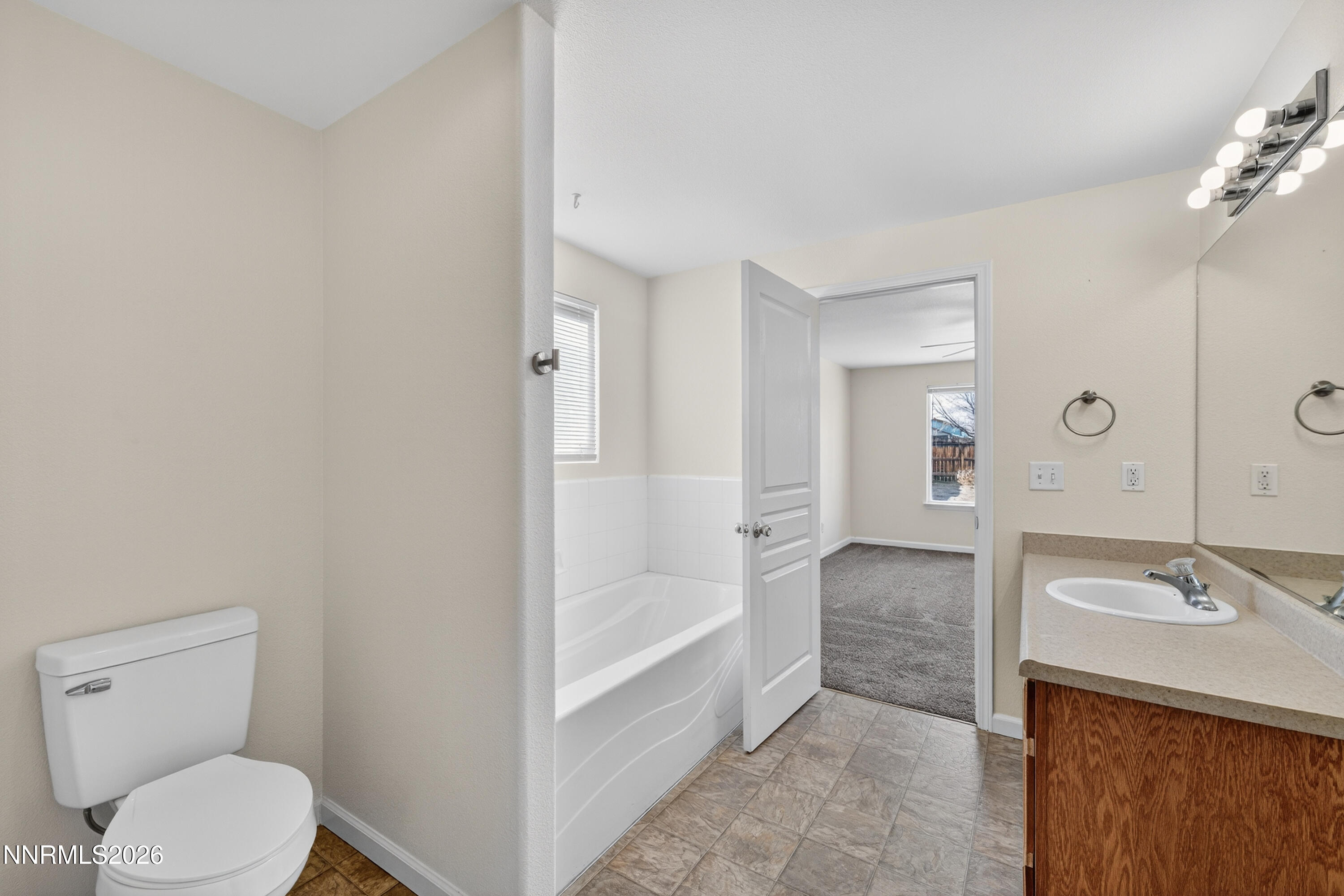 1222 Eagle Rock Road Fallon, NV 89406 - Photo 14 of 27 a bathroom with a sink a toilet and shower