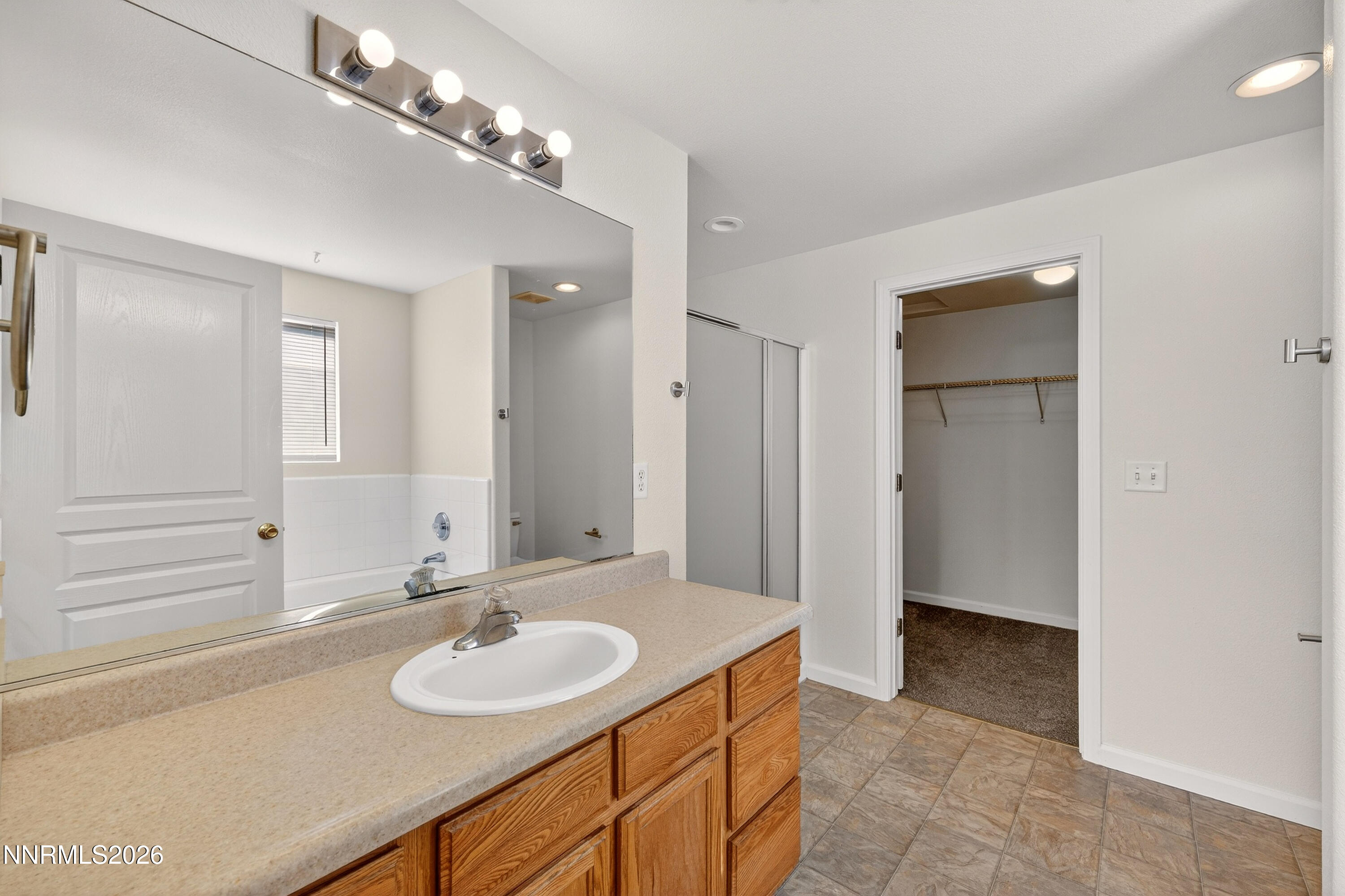 1222 Eagle Rock Road Fallon, NV 89406 - Photo 15 of 27 a bathroom with a sink and a mirror