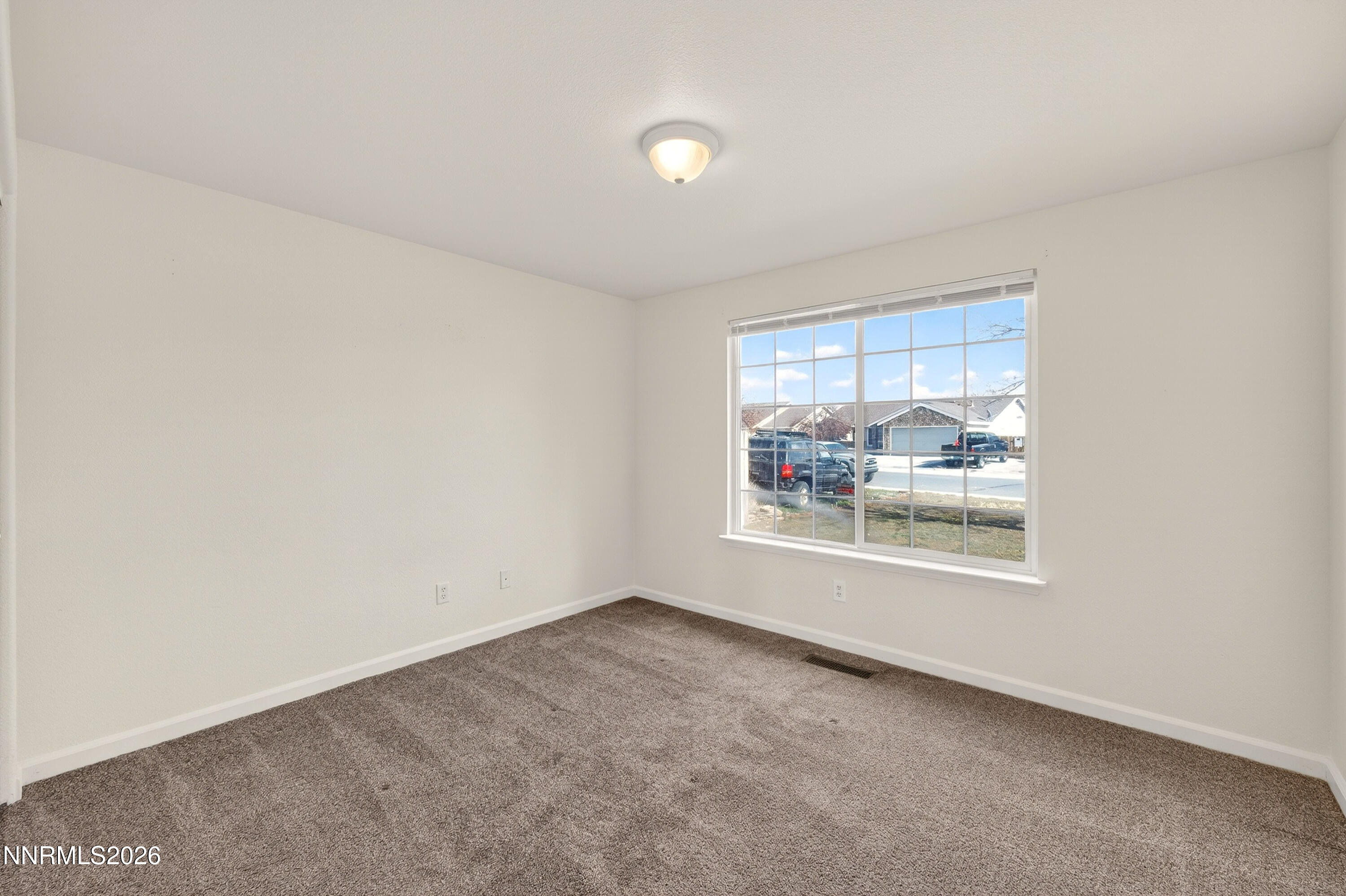 1222 Eagle Rock Road Fallon, NV 89406 - Photo 19 of 27 an empty room with a window