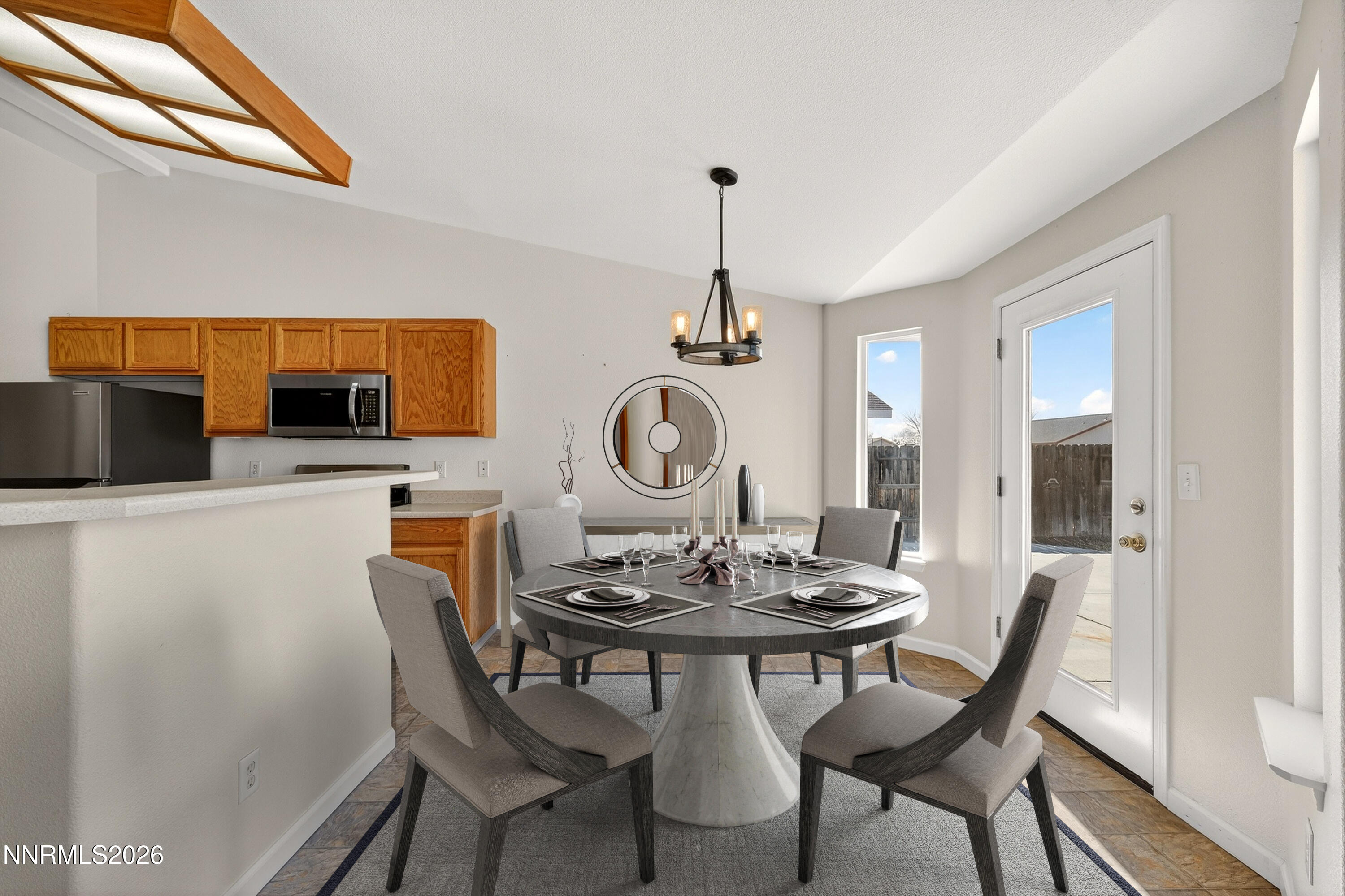 1222 Eagle Rock Road Fallon, NV 89406 - Photo 10 of 27 a view of a dining room with furniture and chandelier
