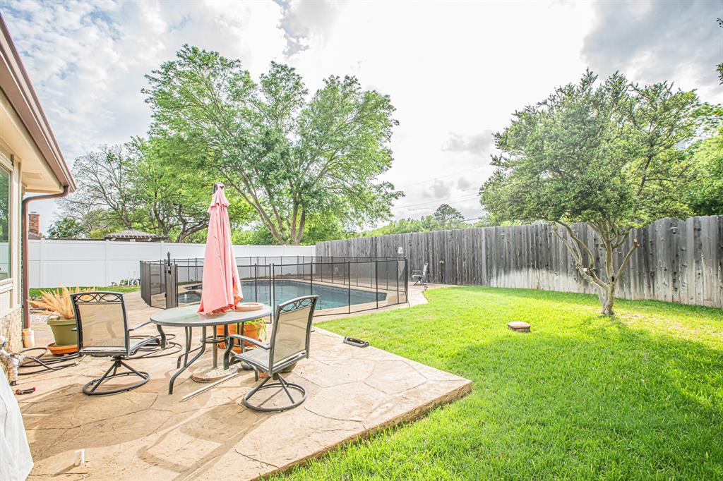3309 Timber View Circle Bedford, TX 76021 - Photo 36 of 38 a view of a backyard with a patio