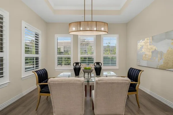 a dining room with furniture and window