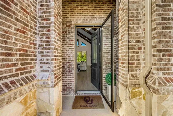 a view of a door and a window