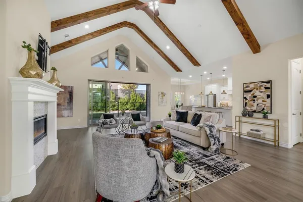a living room with furniture fireplace and flat screen tv