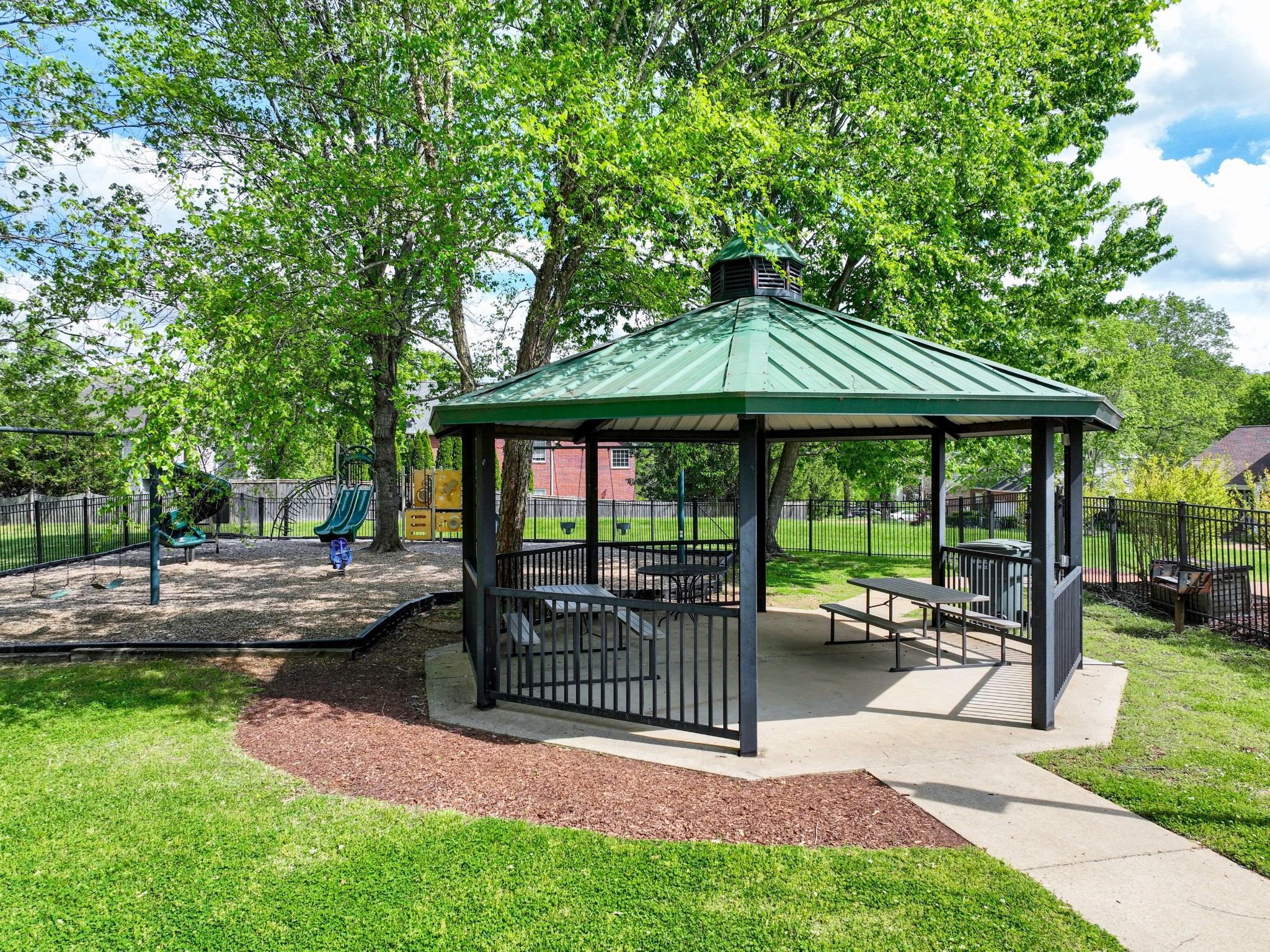 4629 Sandy Creek Road Nashville, TN 37221 - Photo 46 of 48 a view of a patio with a table chairs and a yard