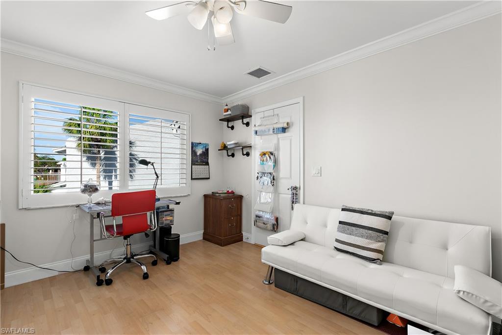 27 Watercolor Way, Unit 27 Naples, FL 34113 - Photo 20 of 36 a bedroom with furniture and a window