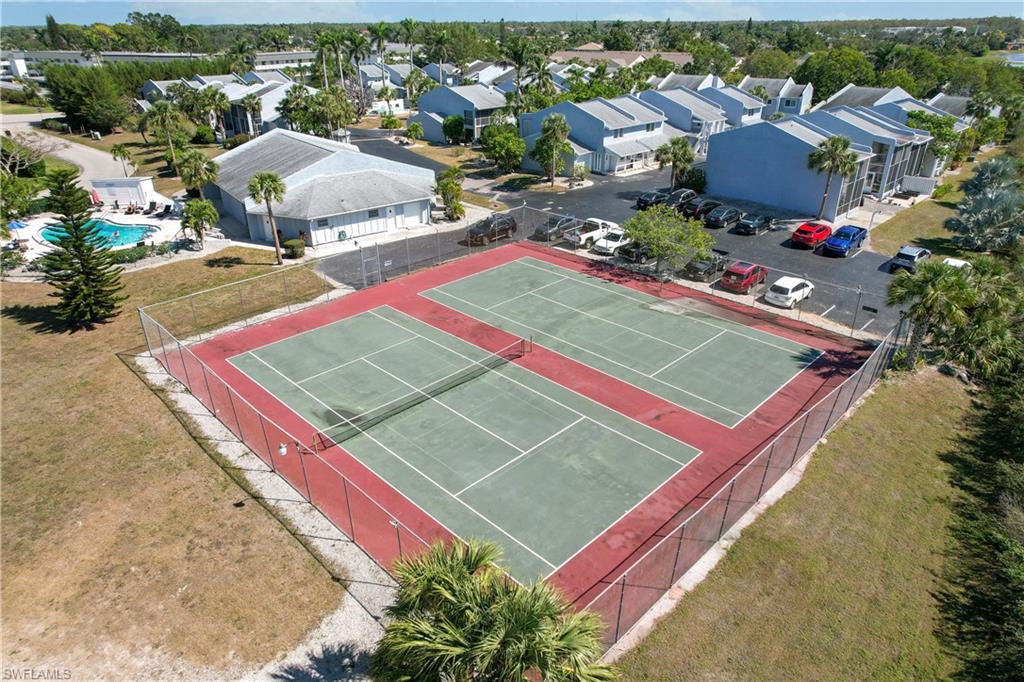 27 Watercolor Way, Unit 27 Naples, FL 34113 - Photo 26 of 36 an aerial view of a pool a house an outdoor space and seating area