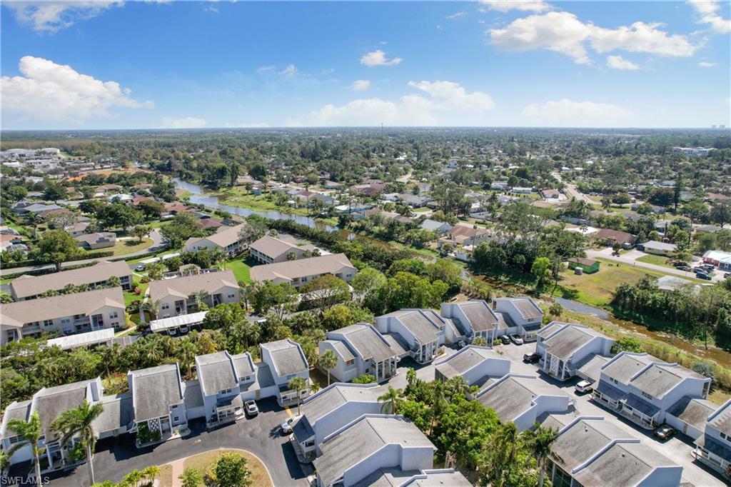 27 Watercolor Way, Unit 27 Naples, FL 34113 - Photo 31 of 36 an aerial view of a city with lots of residential buildings