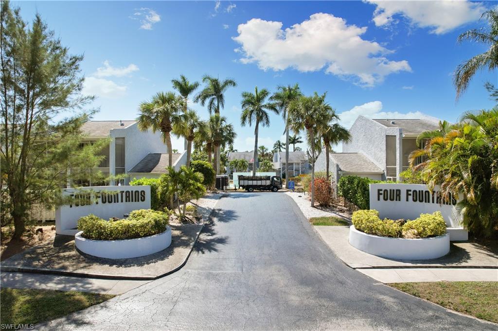 27 Watercolor Way, Unit 27 Naples, FL 34113 - Photo 35 of 36 a view of a backyard of the house