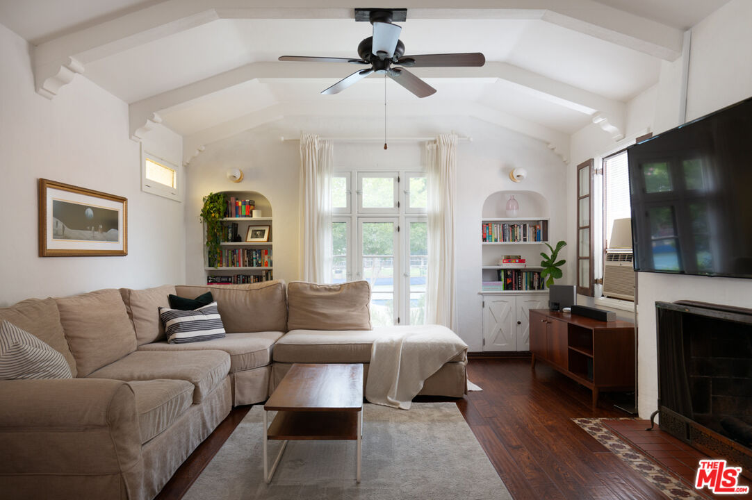 708 South Cedar Street Glendale, CA 91205 - Photo 11 of 38 a living room with furniture a flat screen tv and a fireplace