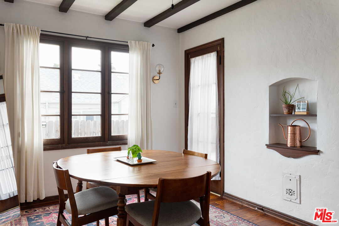 708 South Cedar Street Glendale, CA 91205 - Photo 20 of 38 a view of a dining room with furniture a potted plant and wooden floor