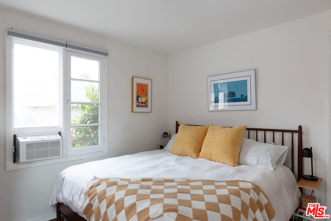 708 South Cedar Street Glendale, CA 91205 - Photo 29 of 38 a bedroom with a large bed and a window