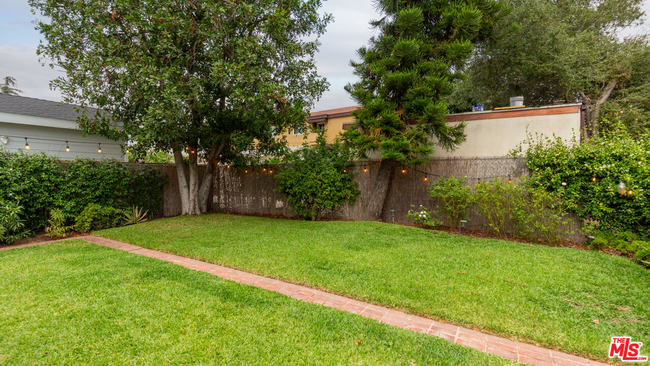 708 South Cedar Street Glendale, CA 91205 - Photo 34 of 38 a view of a backyard with large trees and plants