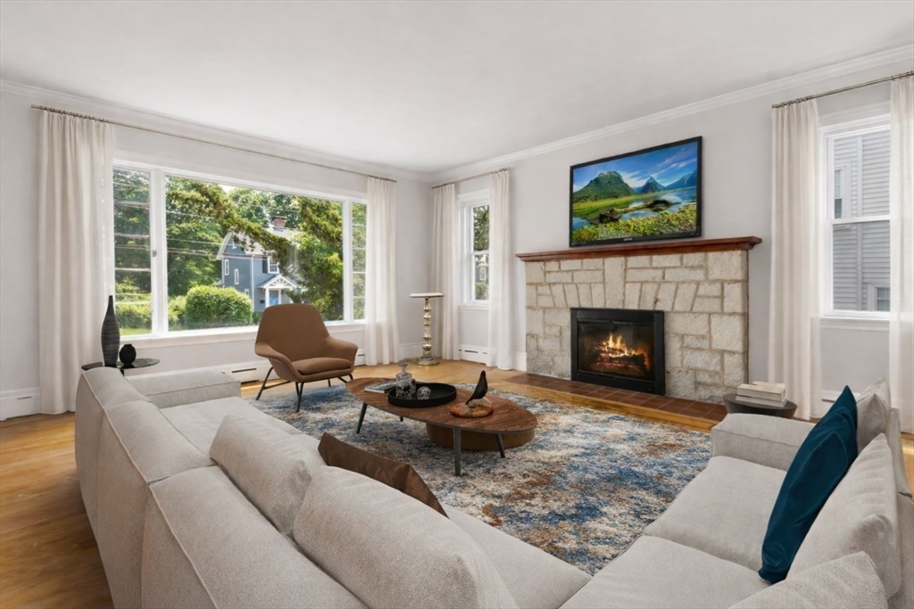 29 Boulevard Road Dedham, MA 02026 - Photo 9 of 34 a living room with furniture and a fireplace