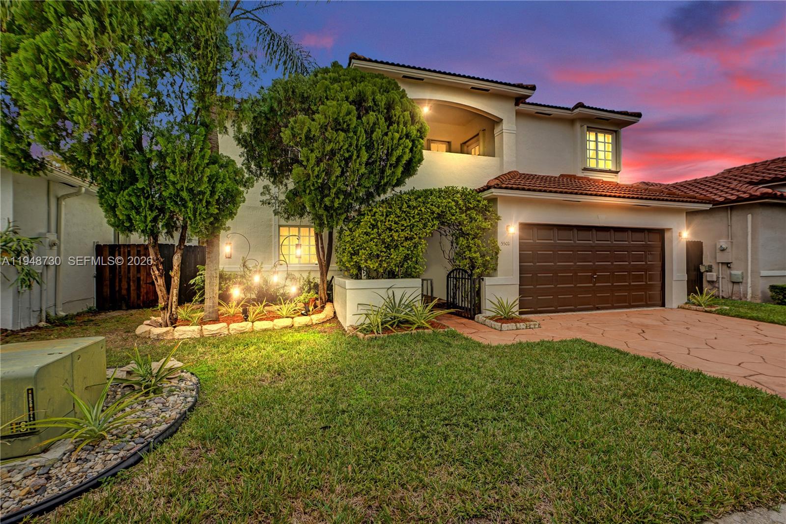 5502 Southwest 162nd Place Miami, FL 33185 - Photo 1 of 72 a front view of a house with a yard