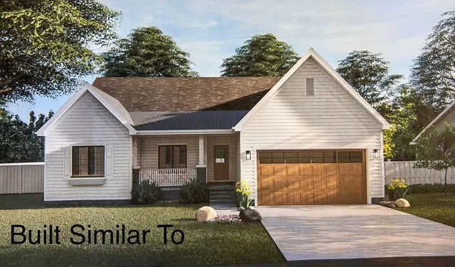 a view of a house with wooden fence
