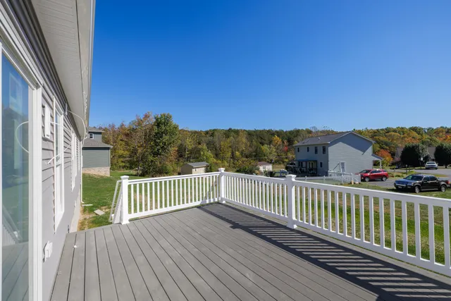 a view of house with backyard