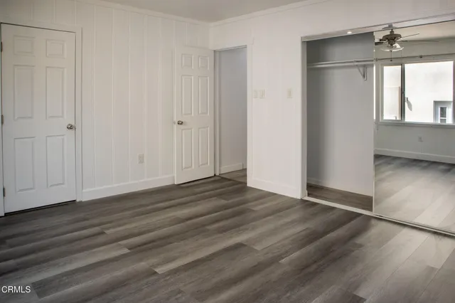 a bathroom with a sink vanity and shower