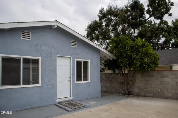 a view of storage and utility room with two washing machine