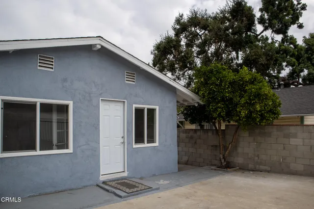 a view of storage and utility room with two washing machine