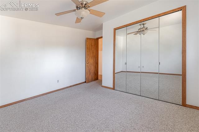 1775 Winnebago Road Colorado Springs, CO 80915 - Photo 12 of 32 Main bedroom upstairs with large mirrored closet doors.