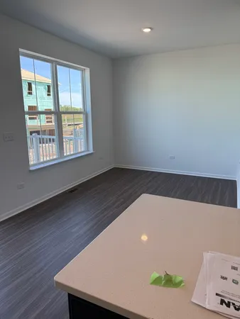 an empty room with wooden floor